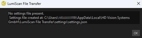 A LumiScan File Transfer window displays a message stating no settings file is present and shows the file path where the settings file was created, with an OK button below